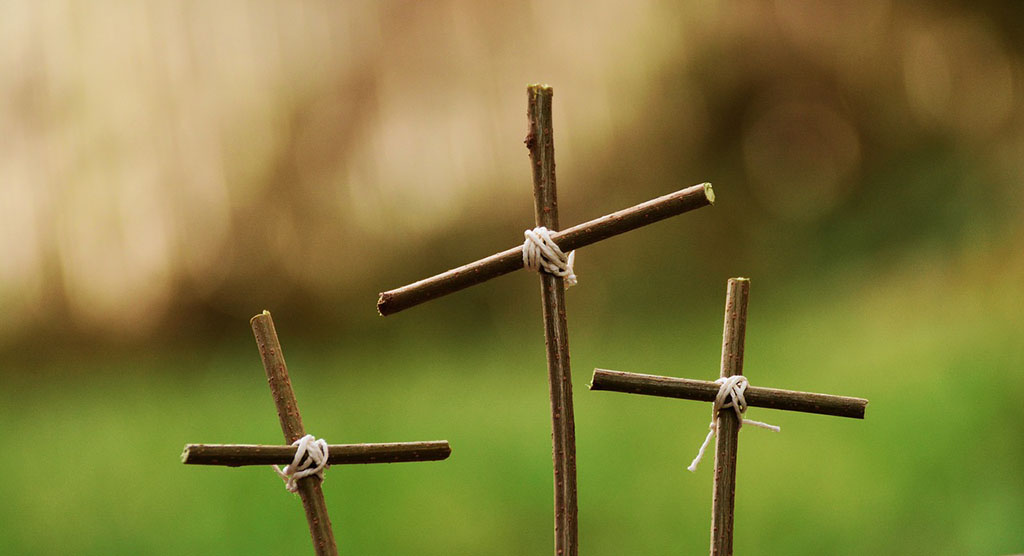 three sapling crosses