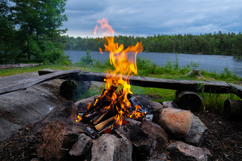 campfire by a lake