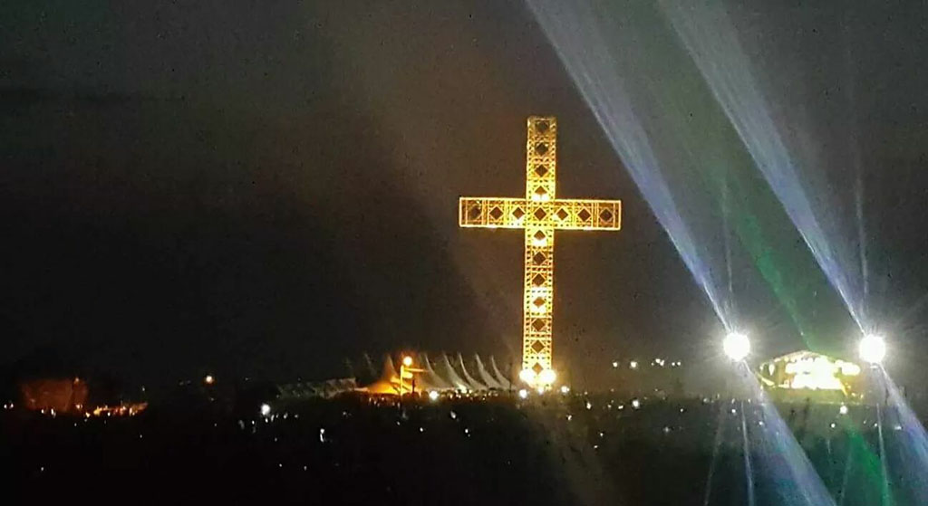 large cross lit up at night