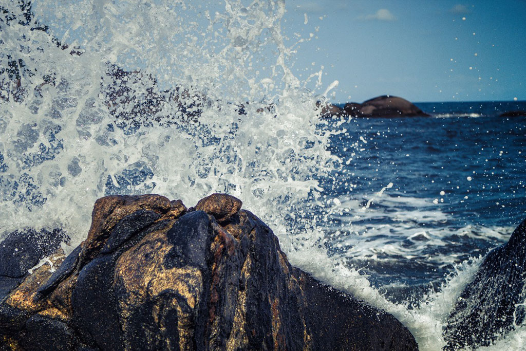 waves crashing on rocky shore