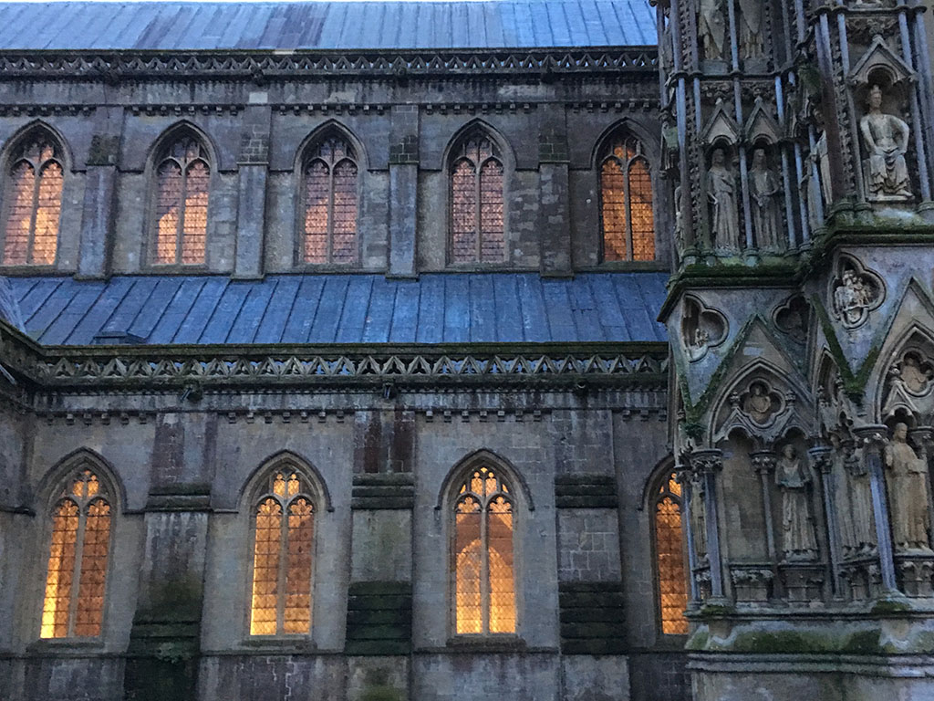 lights in Wells Cathedral at dusk